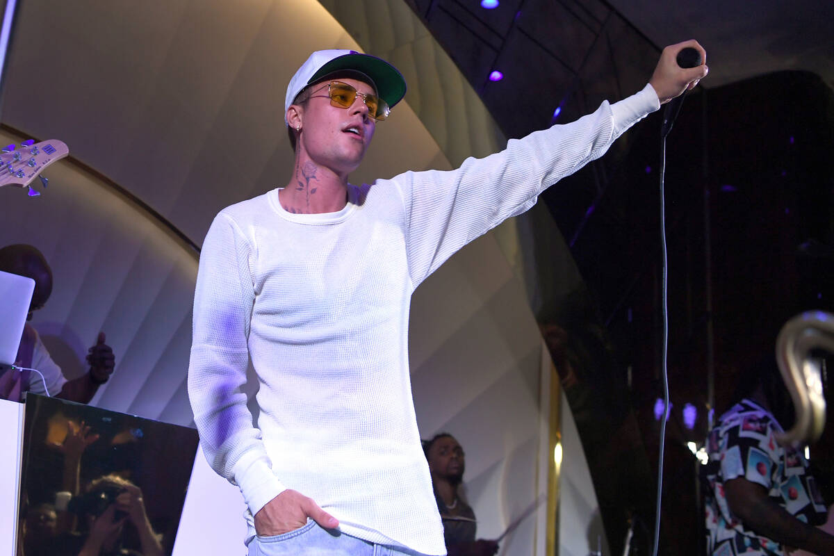 Justin Bieber performs onstage during h.wood Group's grand opening of Delilah at Wynn Las Vega ...