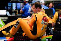 Kyle Busch climbs out of his car after NASCAR Daytona 500 auto race practice at Daytona Interna ...