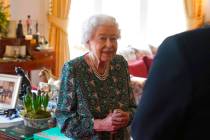 FILE - Queen Elizabeth II speaks during an audience at Windsor Castle where she met the incomin ...