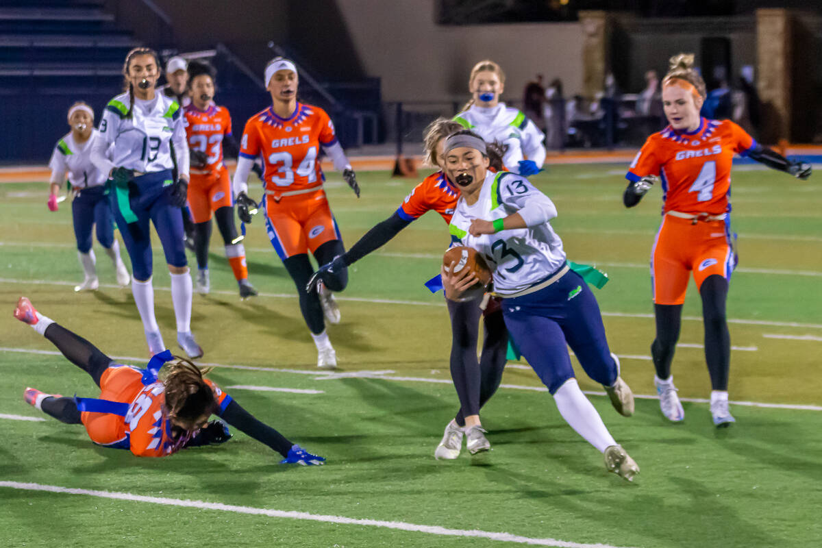 Green Valley's Soriah Tafua avoids Bishop Gorman defenders in a 31-13 Class 5A state semifinal ...