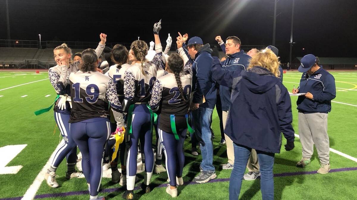The Shadow Ridge flag football team huddles up after a playoff win. The Mustangs will host Gree ...