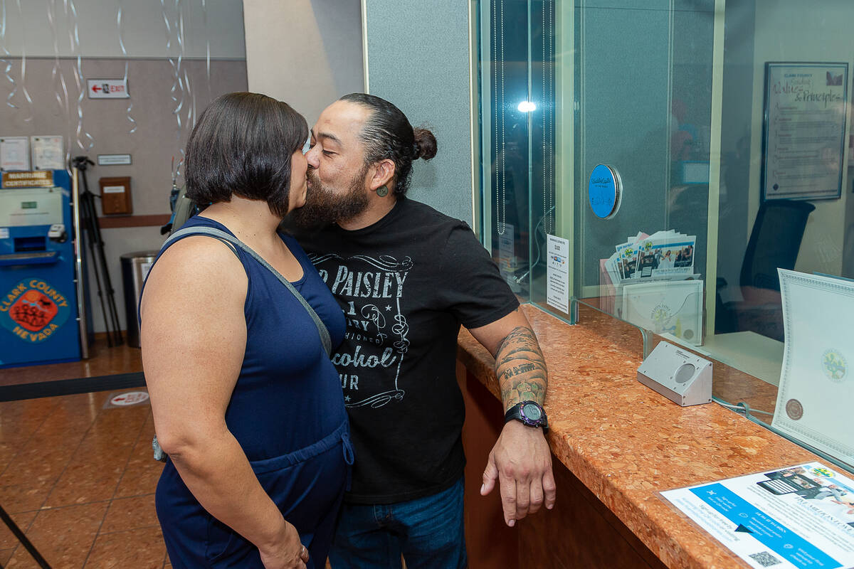 Mayra Ramirez and Luis Pantoja share a kiss when receiving their marriage license at the Clark ...
