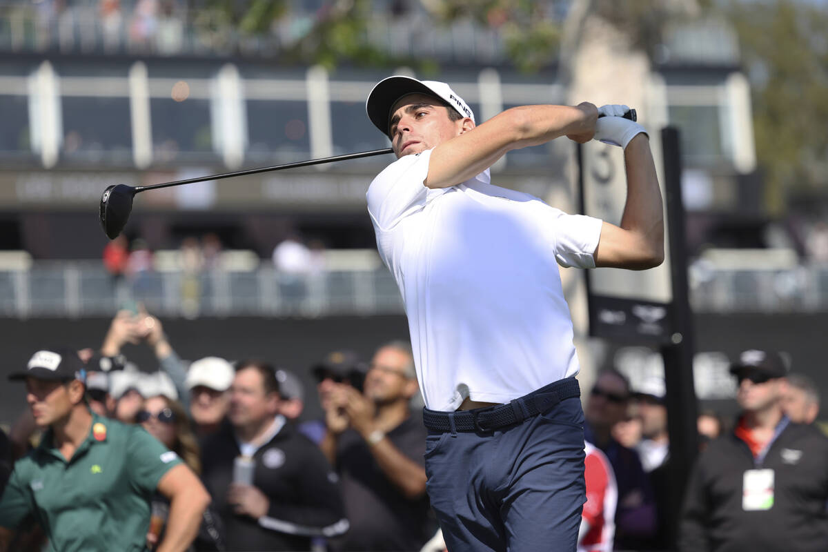 Joaquin Niemann, of Chile, hits his second shot on the first hole during the final round of the ...