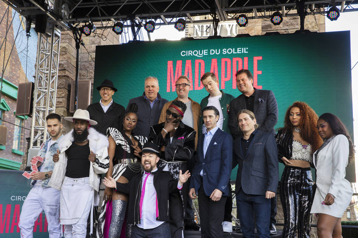 Members of the cast of the new Cirque du Soleil show Mad Apple pose for photos outside New York ...
