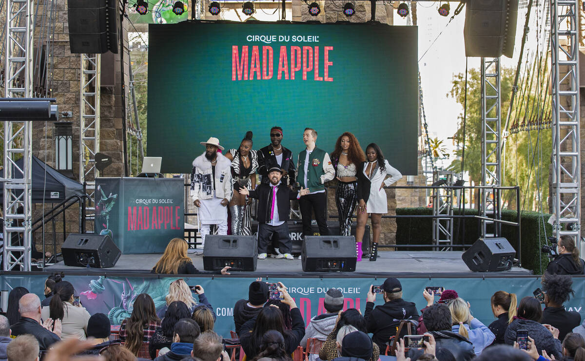 Members of the cast of the new Cirque du Soleil show Mad Apple pose for photos outside New York ...