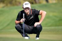 Patrick Cantlay prepares to putt on the second hole during the Phoenix Open golf tournament Fri ...