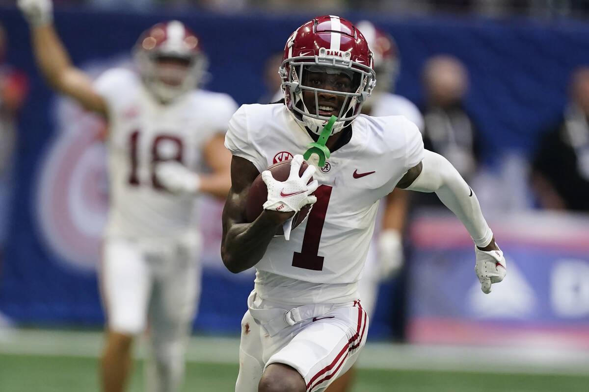 FILE - Alabama wide receiver Jameson Williams (1) scores a touchdown against the Miami during a ...