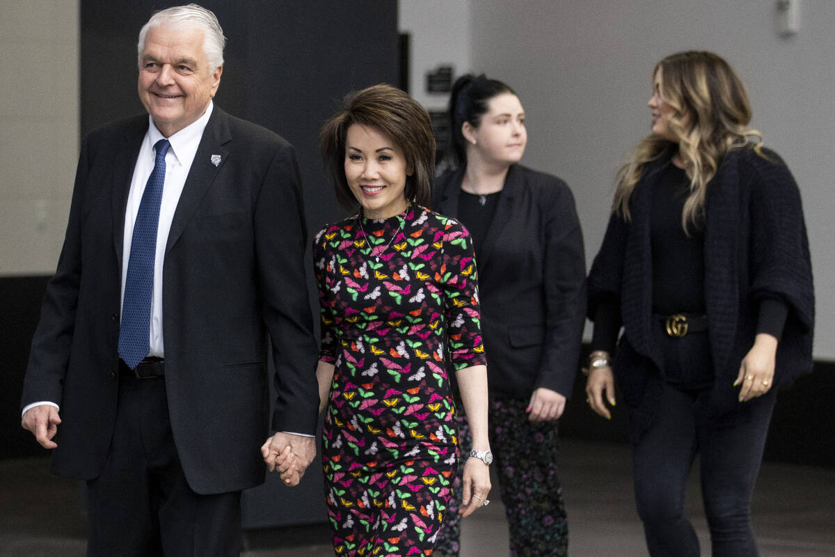 Nevada Gov. Steve Sisolak, from left, his wife Kathy, and daughters Carley and Ashley, enter Al ...