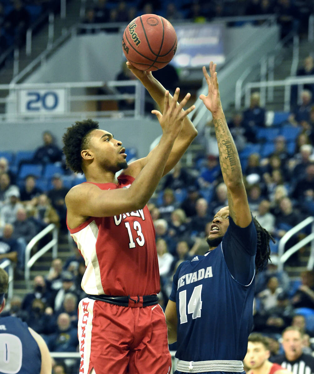 UNLV's Bryce Hamilton shoots over Nevada's Tré Coleman during Tuesday game at Lawlor Event ...
