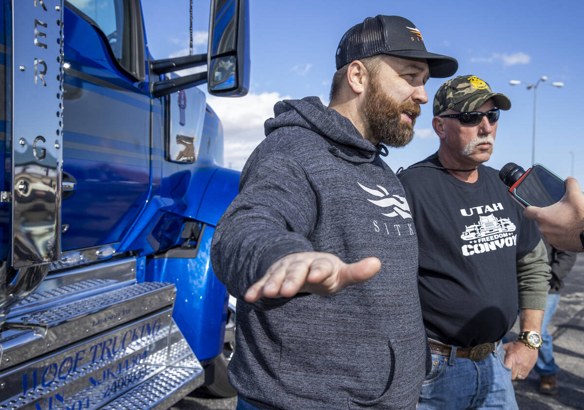 Pastor John Padula of Coeur d'Alene, Idaho, left, talks beside Johnathan Alexander of Wallace, ...