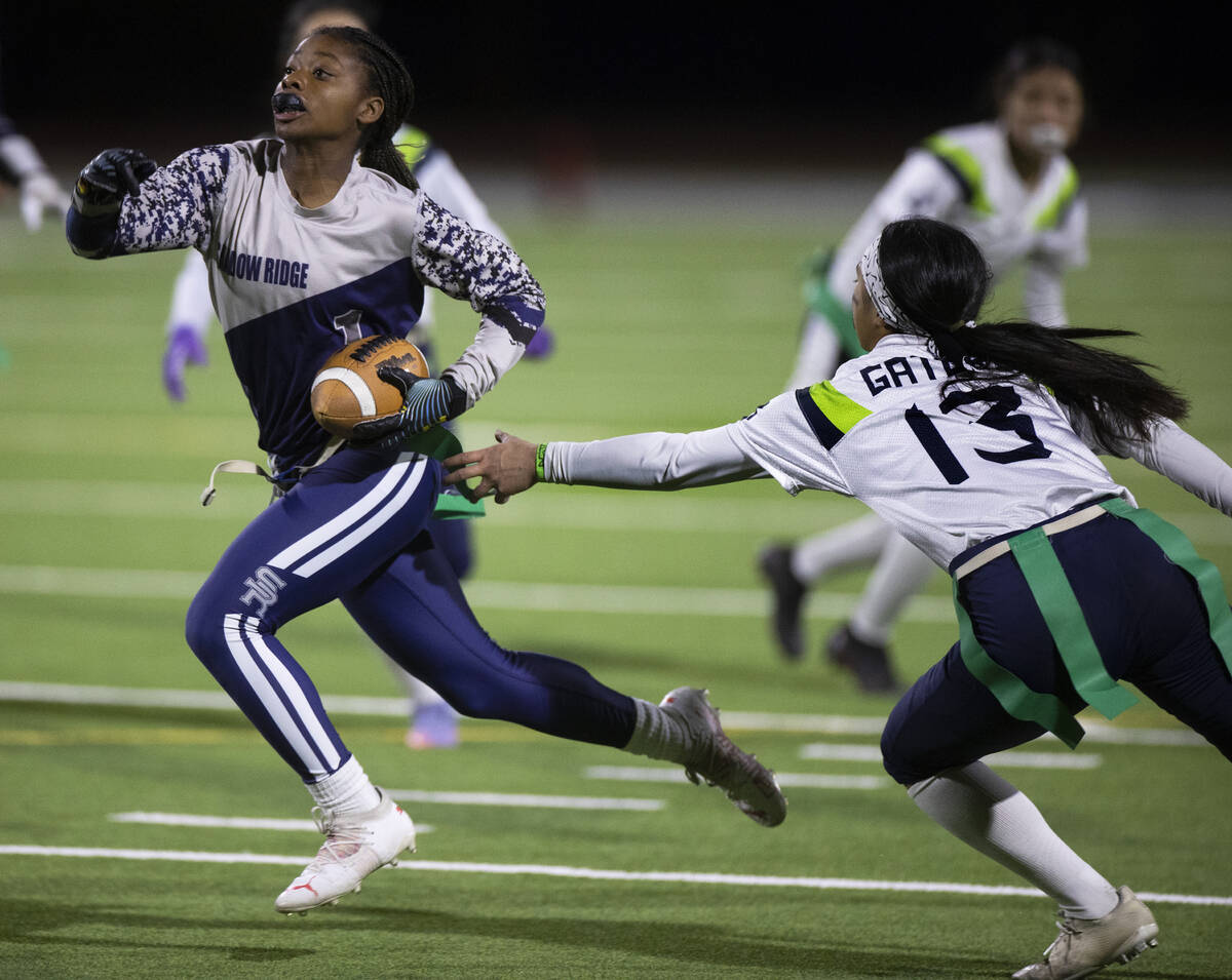 Shadow Ridge’s Riyana Johnson (1) breaks free for a touchdown past Green Valley’s ...