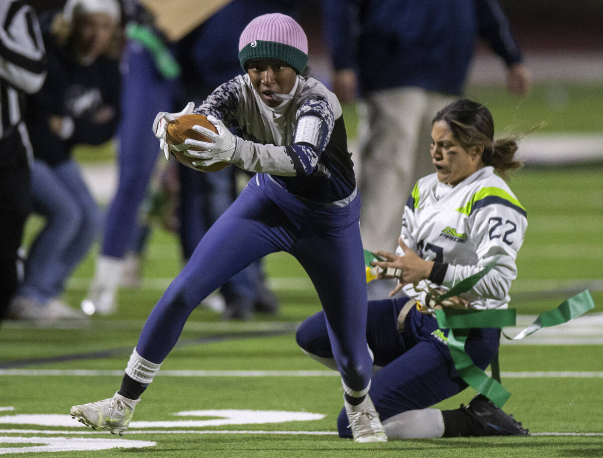 Shadow Ridge’s Dyva Jones (2) makes a big catch and run past Green Valley’s Kalin ...