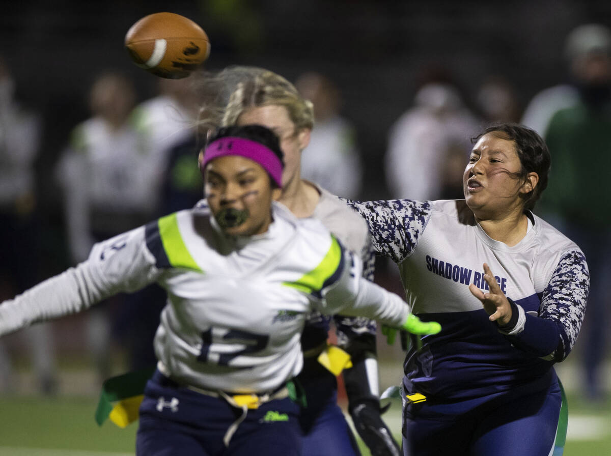 Shadow Ridge’s Mikayla Brown (20) makes a pass with pressure from Green Valley’s ...