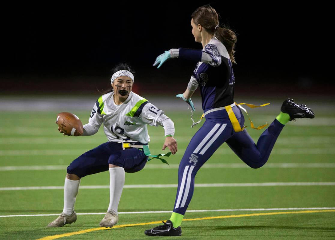Green Valley’s Soriah Tafua (13) evades Shadow Ridge’s Audrey Gadeski (13) during ...