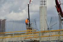 A construction worker pours a second-floor column at Centennial Subaru, Southern Nevada’s new ...
