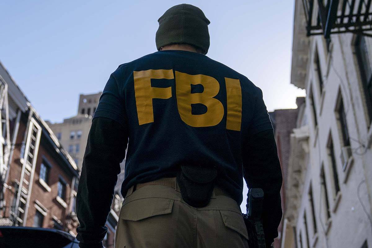This Oct. 19, 2021 file photo shows a federal agent in New York. An FBI agent from New York has ...