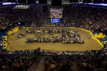 Competitors gather in the arena as the fans applaud at the start of the opening night of Wrangl ...