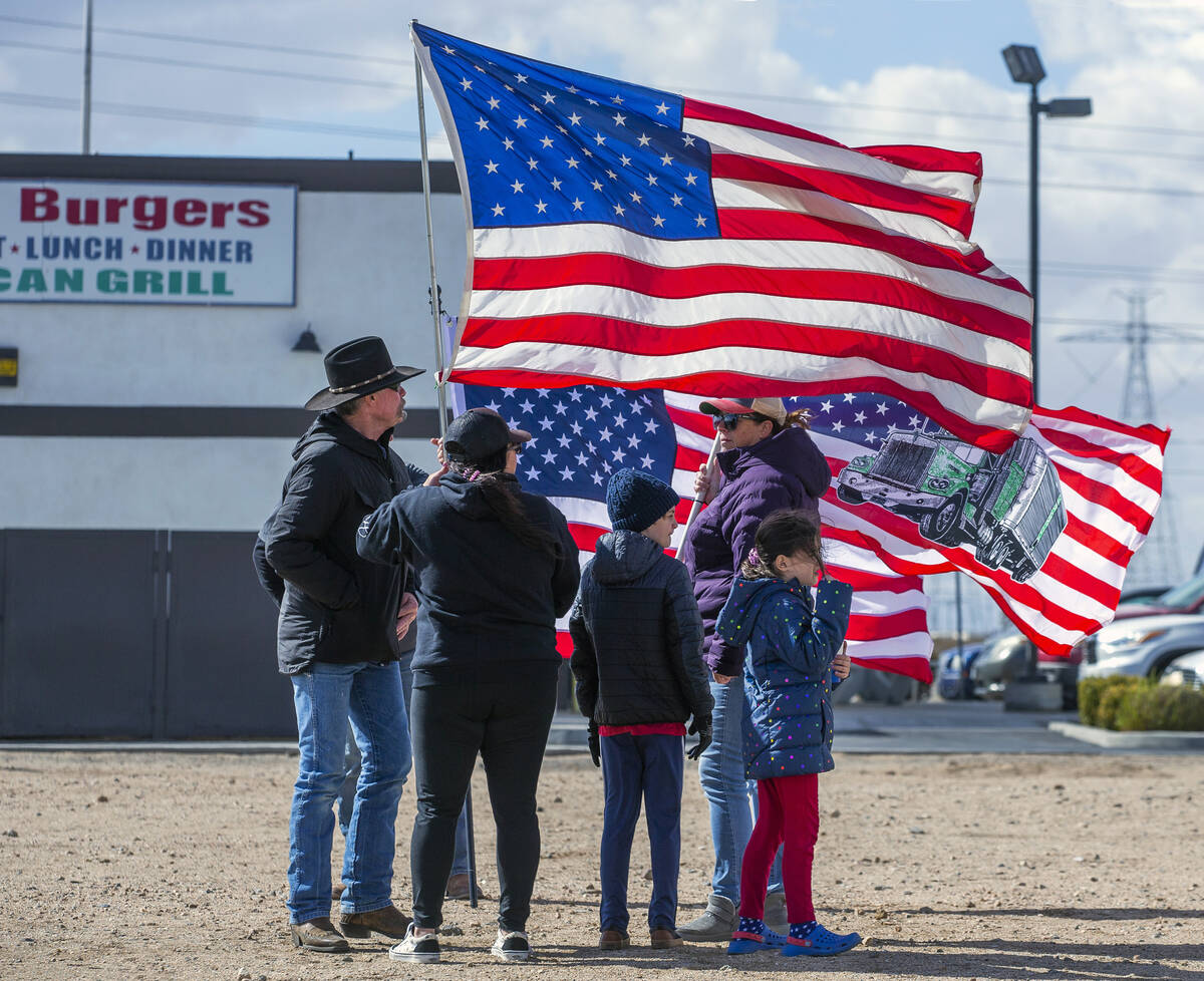 Attendees endure cold and high winds as they arrive early for The People’s Convoy stagin ...