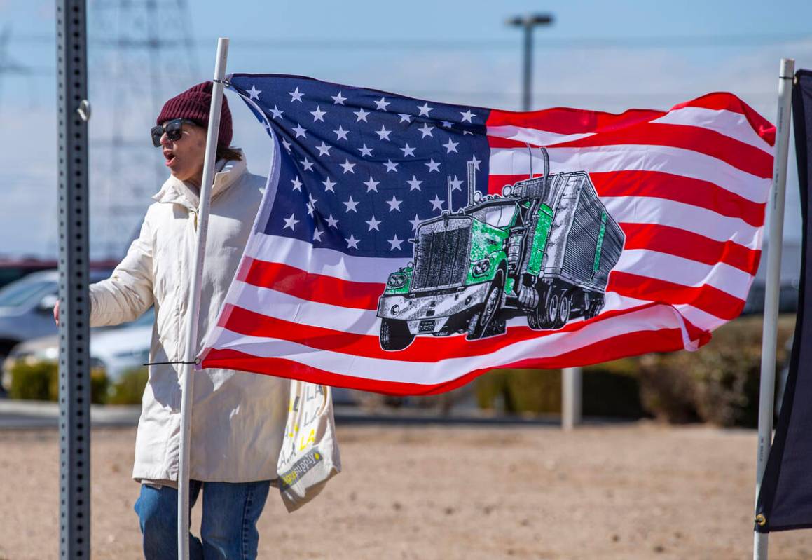 A semi truck on American flag is a popular item for The People’s Convoy as attendees arr ...