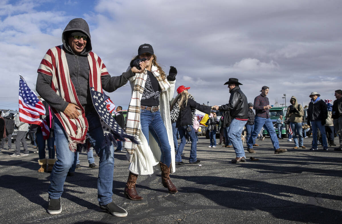 Jeff Mueller and Denise Ferrier from Orange County dance along with others during a departure e ...