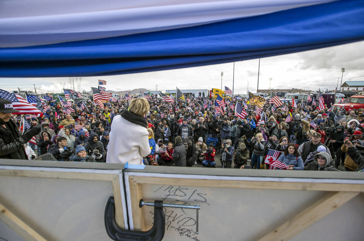 Attorney Leigh Dundas warms up the crowd during a departure event for The People’s Convo ...
