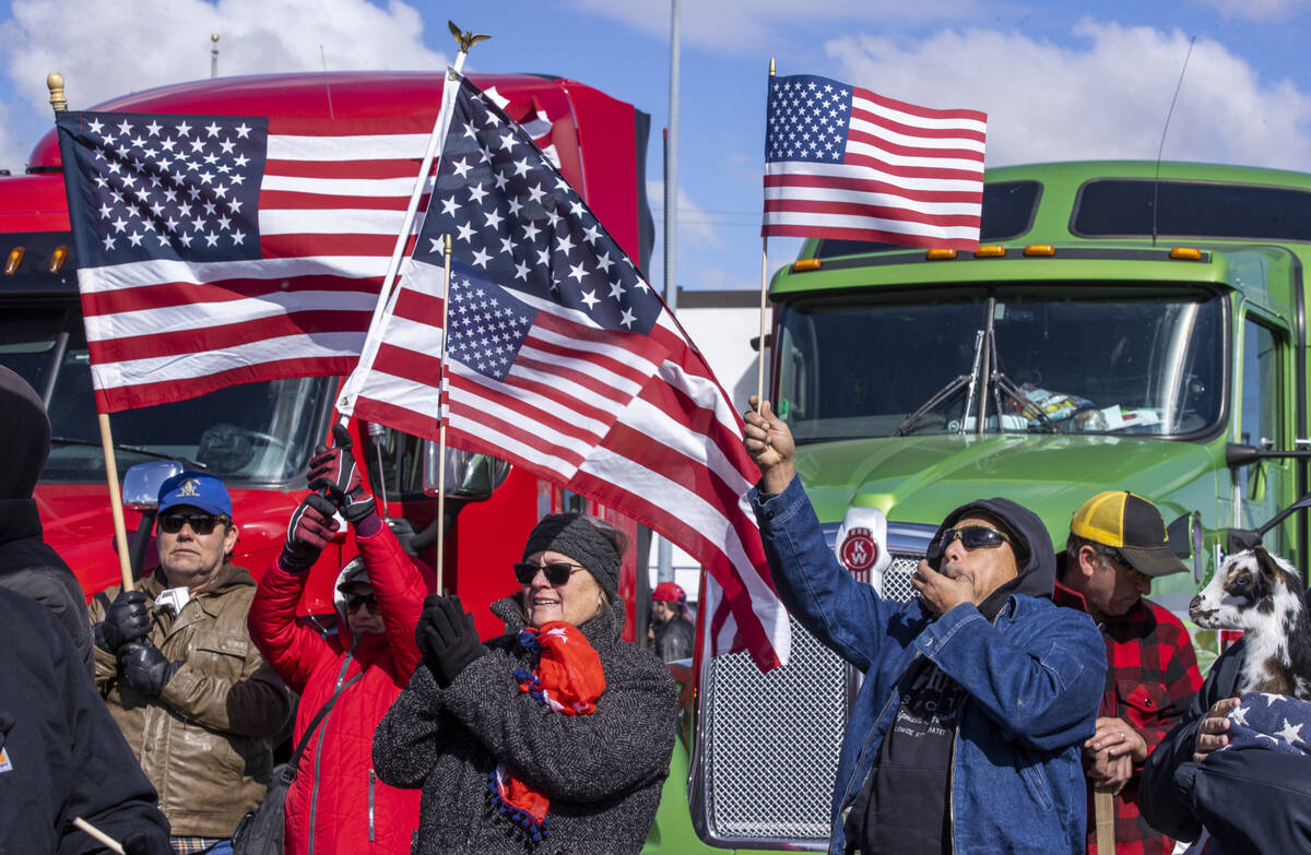 Attendees cheer while listening to speakers during a departure event for The People’s Co ...