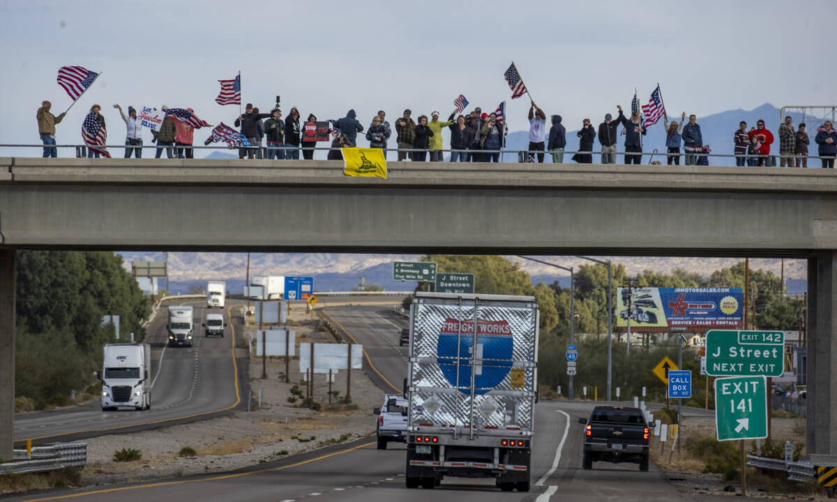 Supporters line an I-40 overpass in Needles awaiting The People’s Convoy who departed Ad ...