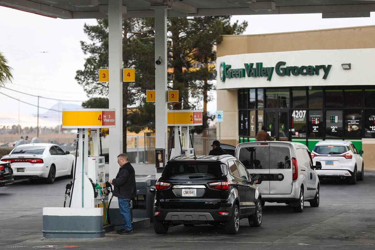 Customers fill up their cars with gas at a Shell gas station in Las Vegas on Wednesday, Feb. 23 ...