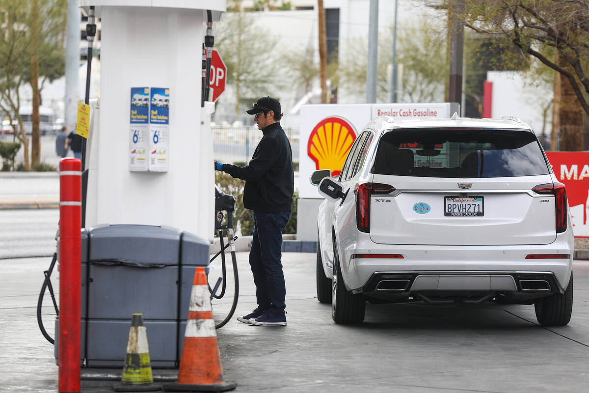 A customer fills up his car with gas at a Shell gas station in Las Vegas on Wednesday, Feb. 23, ...