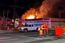 Las Vegas firefighters battle a two-alarm blaze at the Apollo Market on North Jones Boulevard e ...