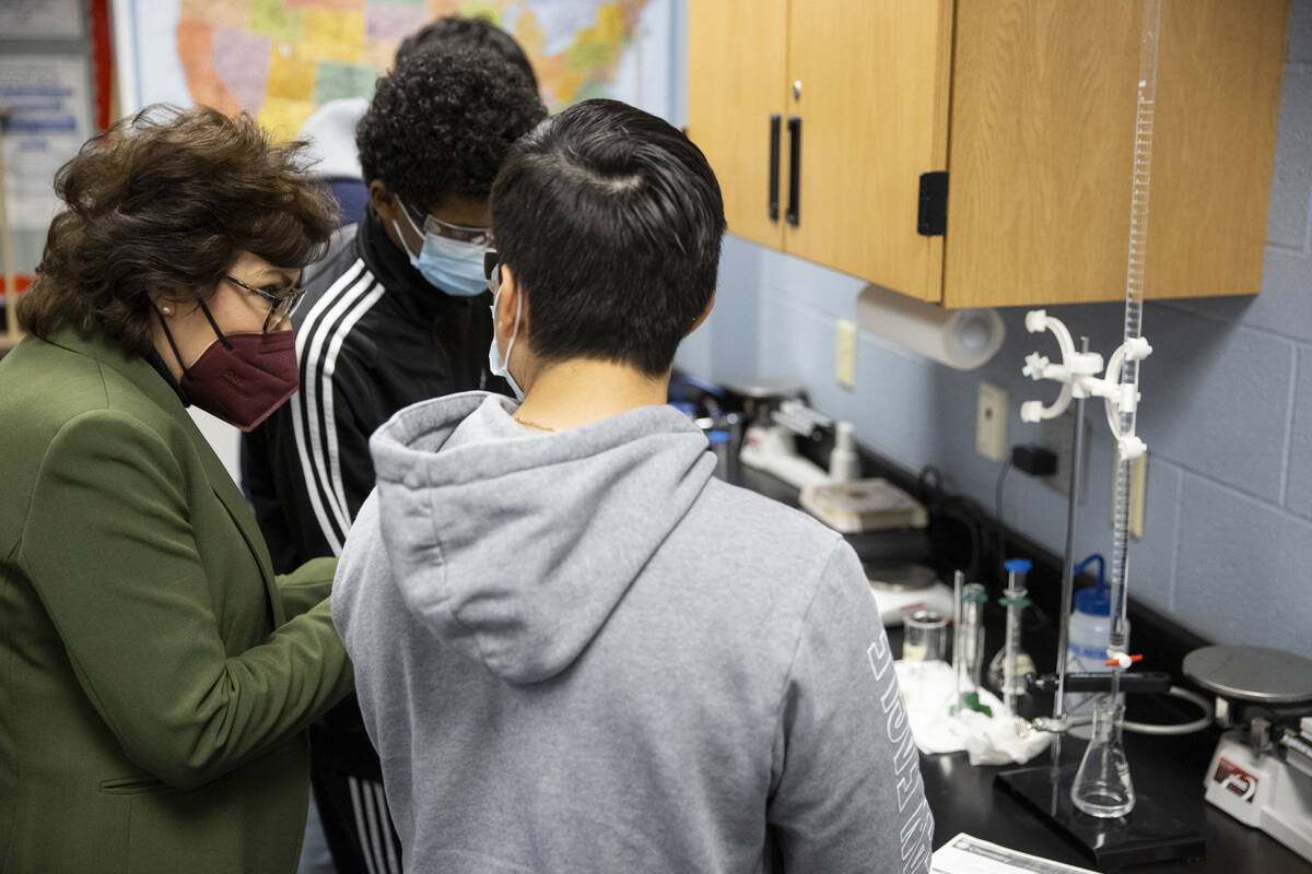 U.S. Sen. Jacky Rosen, far left, speaks to chemistry class students during a tour at Spring Val ...