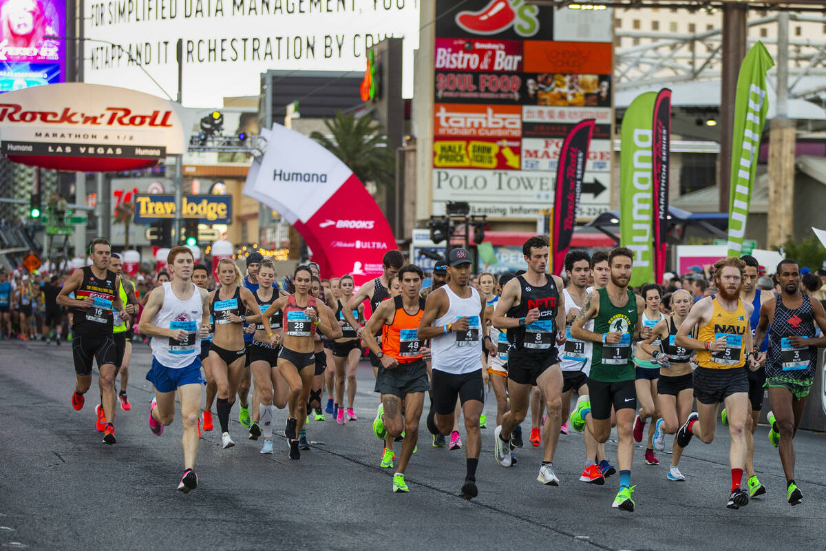 Elite runners leave the starting line during the Las Vegas Rock-N-Roll Marathon along the Strip ...