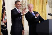 In a Jan. 21, 2010, file photo President Barack Obama and Vice President Joe Biden acknowledge ...