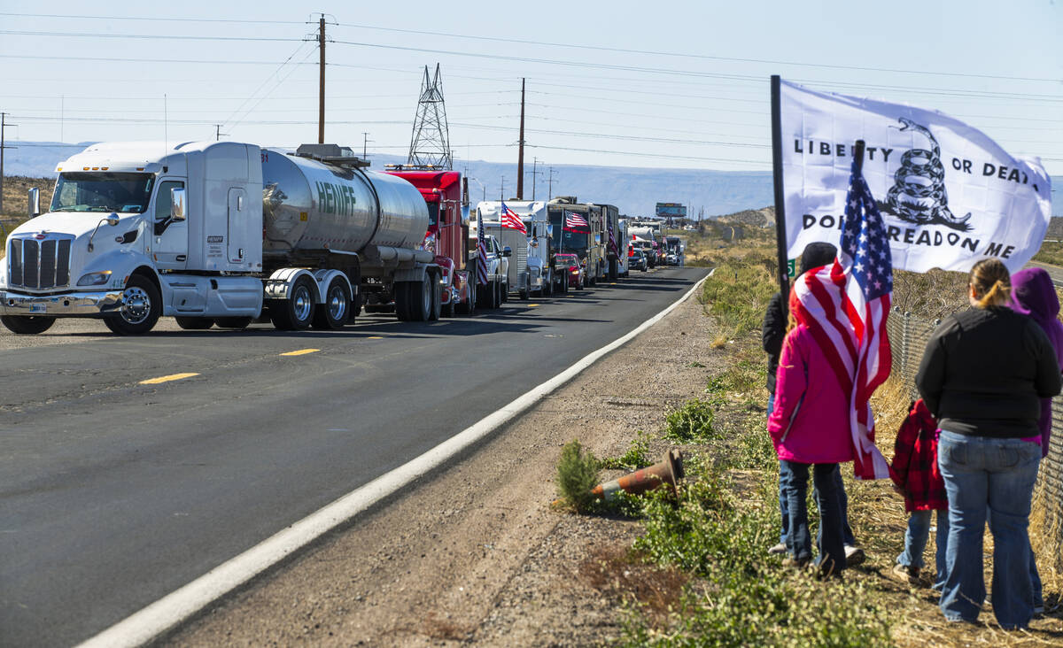 Truckers and support vehicles with The People’s Convoy line up to enter Crazy Fred&#x201 ...
