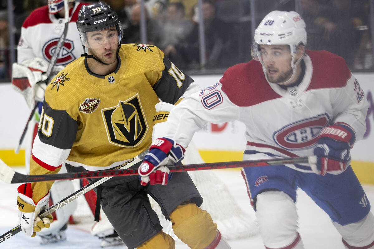 Golden Knights center Nicolas Roy (10) and Canadiens defenseman Chris Wideman (20) skate for th ...