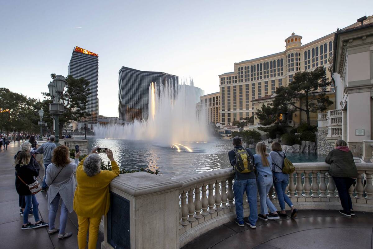 People watch the Bellagio Fountains on Wednesday, Jan. 19, 2022, in Las Vegas. (L.E. Baskow/Las ...