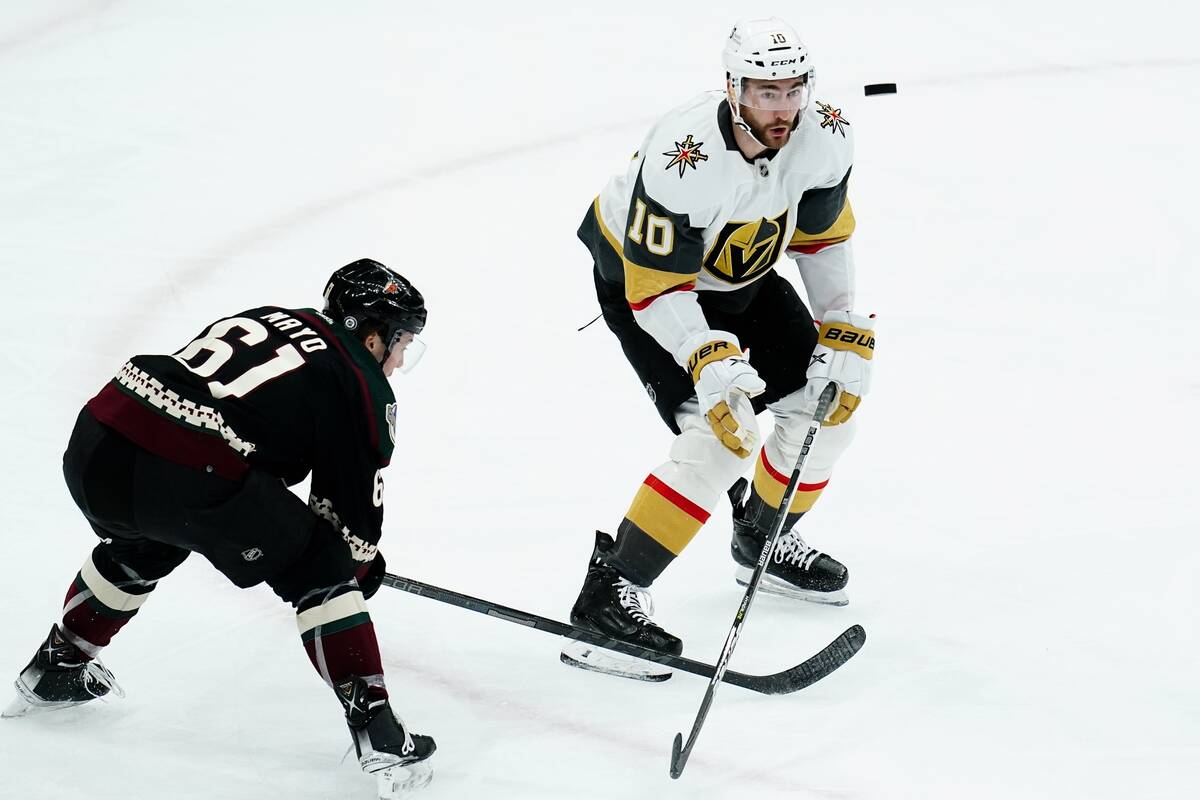 Arizona Coyotes defenseman Dysin Mayo (61) pops the puck up in front of Vegas Golden Knights' N ...