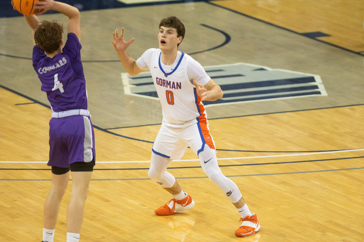 Bishop Gorman's Ryan Abelman guards John Sheets of Spanish Springs High School during the NIAA ...