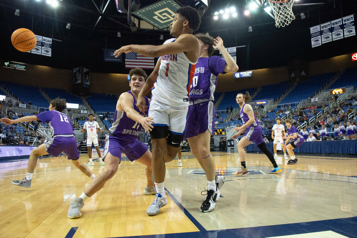 Bishop Gorman's James Freeman passes the ball during the NIAA Class 5A boys basketball state se ...