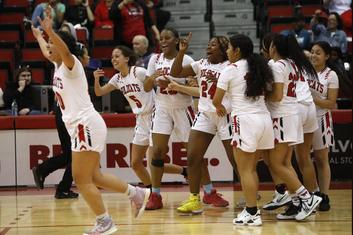 Las Vegas High School players celebrate their victory against Desert Pines High School after th ...