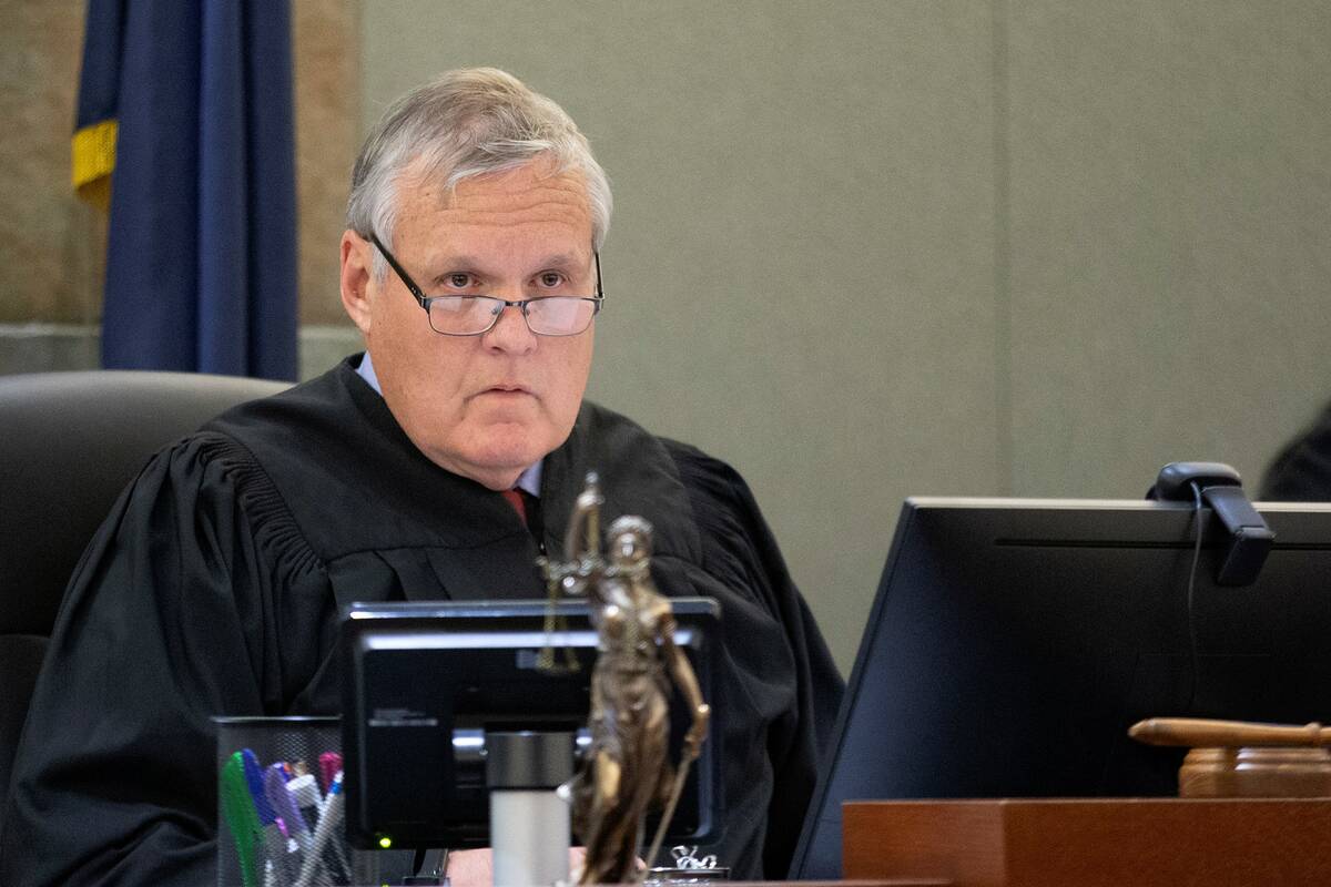 Judge David Barker presides over a hearing in district court at the Regional Justice Center on ...