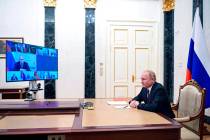 Russian President Vladimir Putin chairs a Security Council meeting via videoconference in Mosco ...