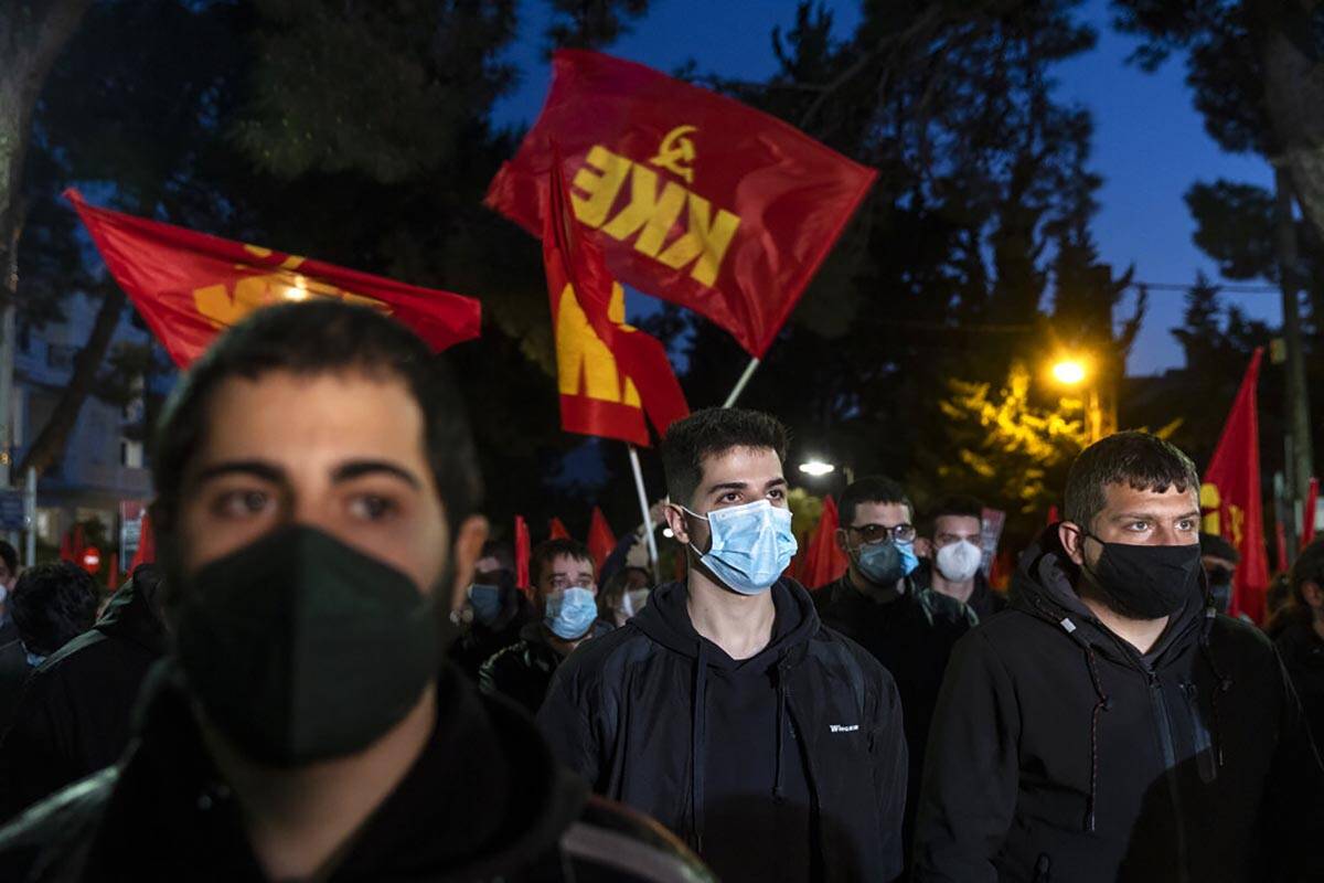 Supporters of the Greek Communist party stage a protest against the Russian invasion of Ukraine ...