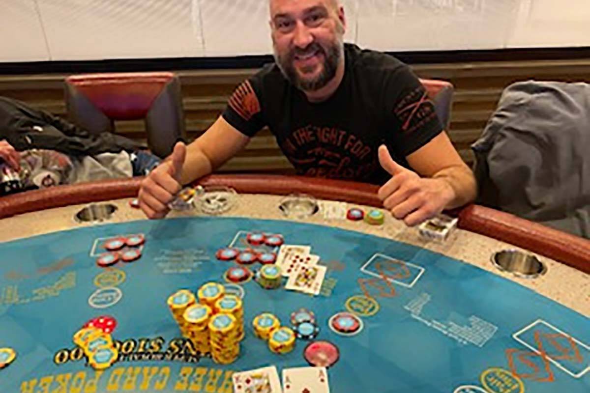 Mitchell Stachowiak of St. Paul, Minnesota, with his winning hand that paid him $145,567 in a g ...