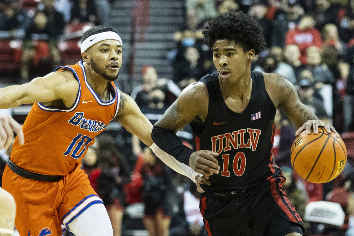 UNLV Rebels UNLV Rebels guard Keshon Gilbert (10) tries to break through Boise State Broncos de ...