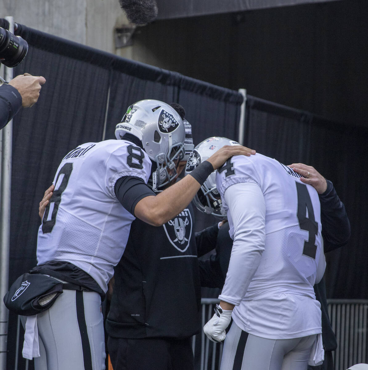 Raiders quarterback Marcus Mariota (8), Raiders quarterback Nathan Peterman (3) and Raiders qua ...
