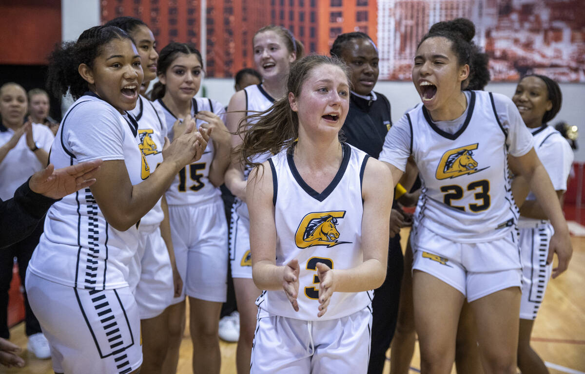 Clark guard Taylor Gauthier (3) and others are announced to receive individual medals for their ...