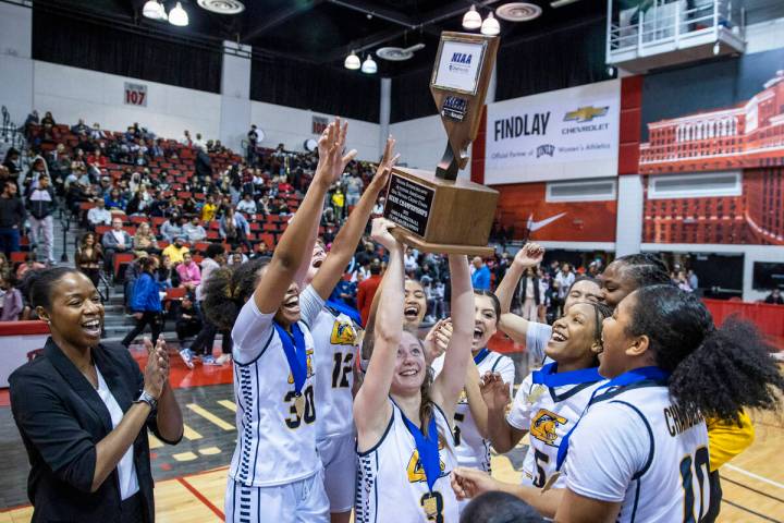 Clark players celebrate their win over Las Vegas after defeating them 43-25 following the secon ...