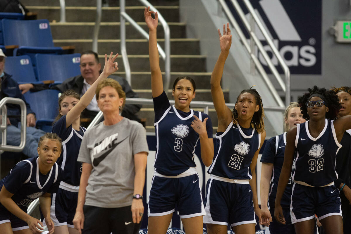 The Centennial High School bench cheers during the NIAA Class 5A girls basketball state champio ...