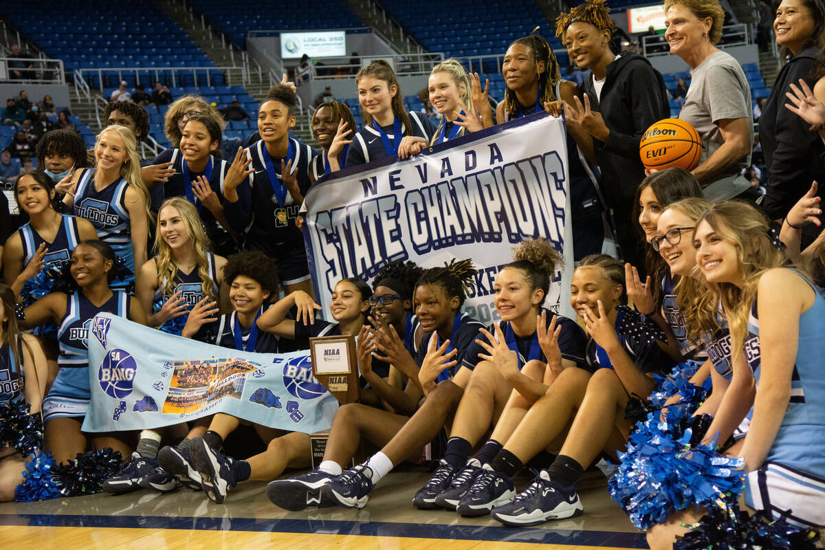 Centennial High School celebrates their win over Biship Manogue in the NIAA Class 5A girls bask ...
